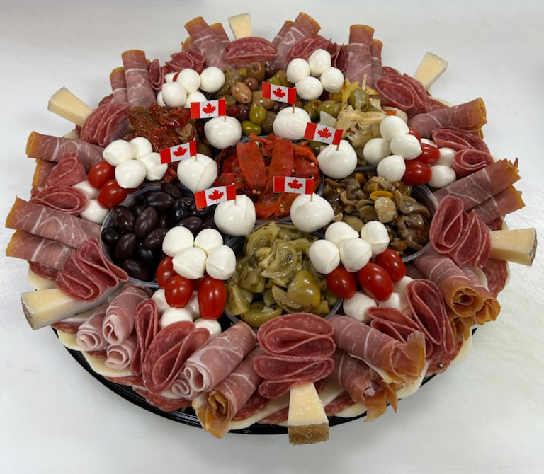A curated selection of Salami, Prosciutto, Mozzarella & more on a round platter